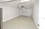 Immaculate 1-car garage with polished terrazzo floor.